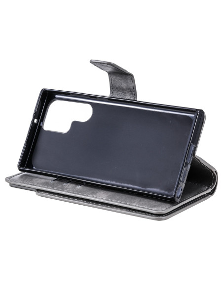 Grå plånboksfodral med öppet lock, sett bakifrån, som visar insidan och facket för Samsung S25 Ultra