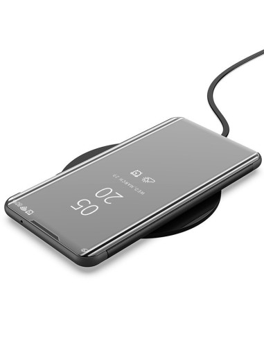 Samsung A32 5G flipfodral i svart, visat på trådlös laddare med skärmen synlig