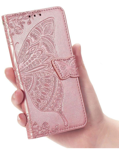 Plånboksfodral i rosa PU-läder med fjärilsmotiv, hålls i hand med stängning