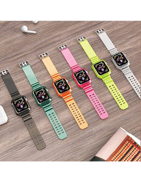 Apple Watch med stöttåligt och genomskinligt armband i olika färger på ett bord