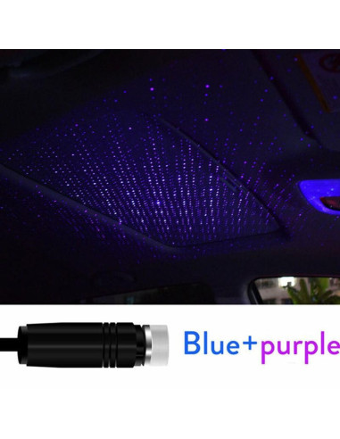 Närbild av bärbar USB LED rymdprojektor som projicerar blå och lila stjärnor i bilens tak