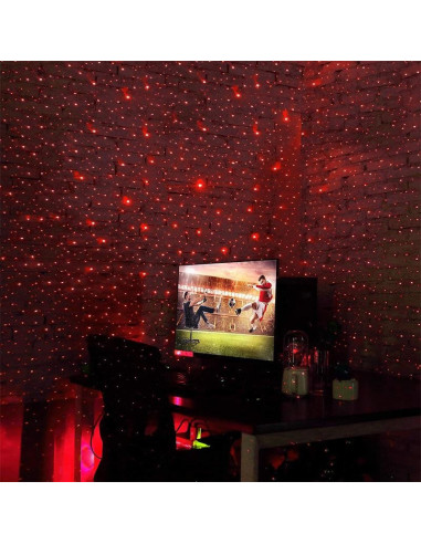 Röd ljusprojektion från bärbar USB LED rymdprojektor i rumsmiljö