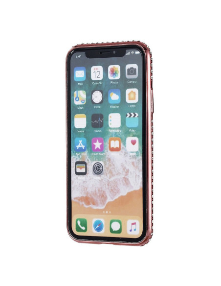 iPhone X med rosenguldsskal och strassdetaljer, visad från sidan med skärmen på