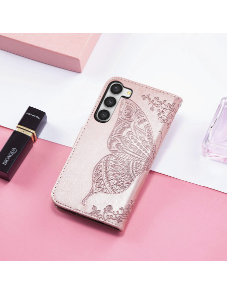 Närbild av rosa plånboksfodral för Samsung S23 FE med detaljerat fjärilsmotiv