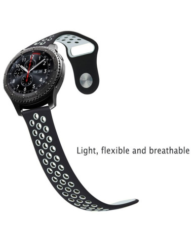 Svart silikonarmband med perforeringar, monterat på en smartwatch